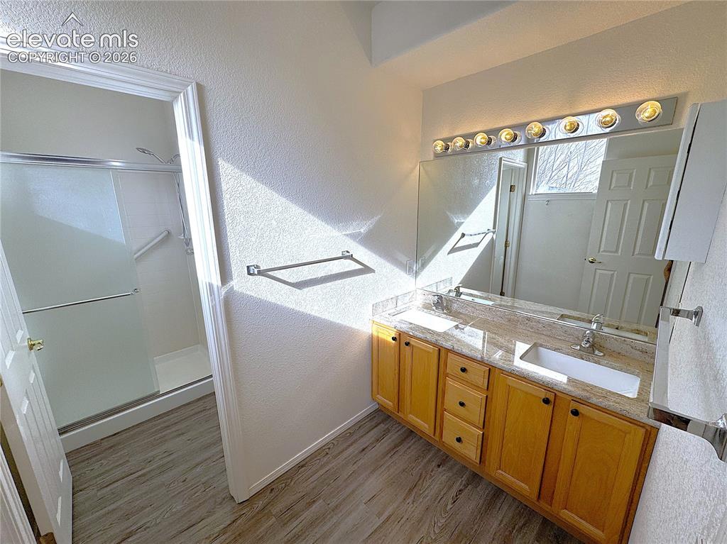 Image 18 of 49: Double Sinks, Toilet and Walk-in Shower