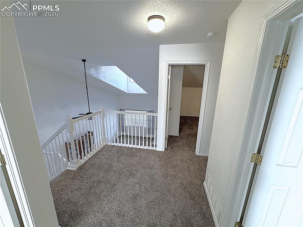 Image 19 of 49: Upstairs hallway and Loft area