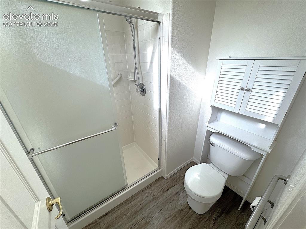 Image 19 of 49: Separate Walk-in Shower and Toilet