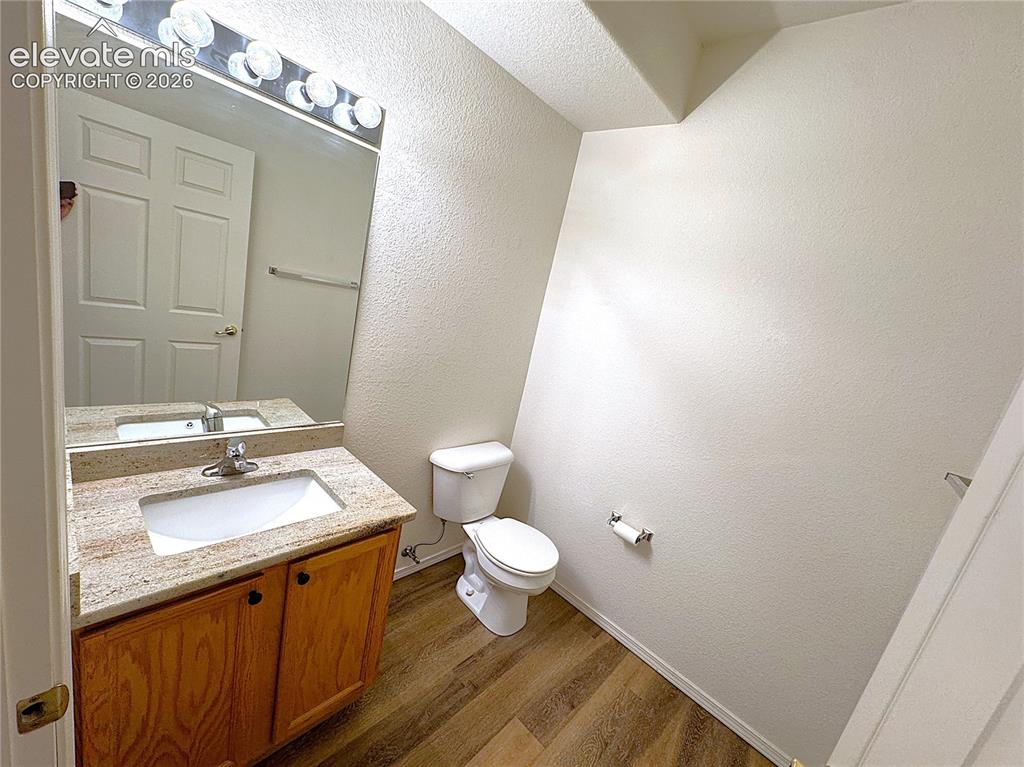 Image 21 of 49: Main Level Powder Bathroom