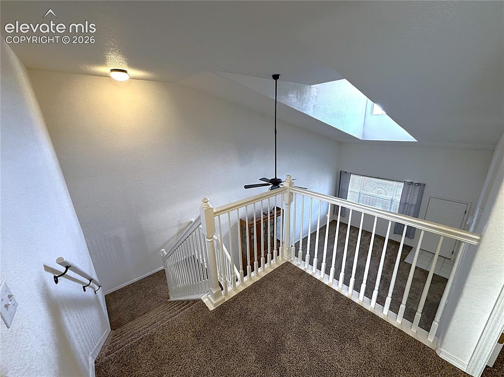 Image 23 of 49: Vaulted ceiling with Loft overlooking Great Room area
