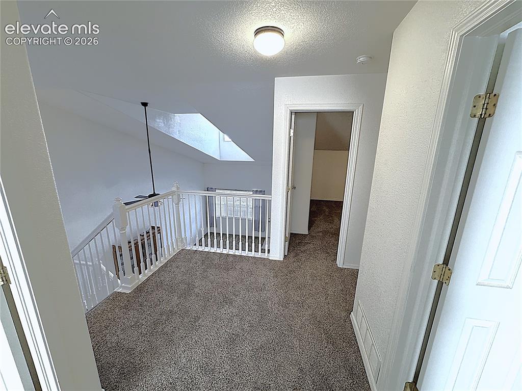 Image 24 of 49: Upstairs hallway and Loft area