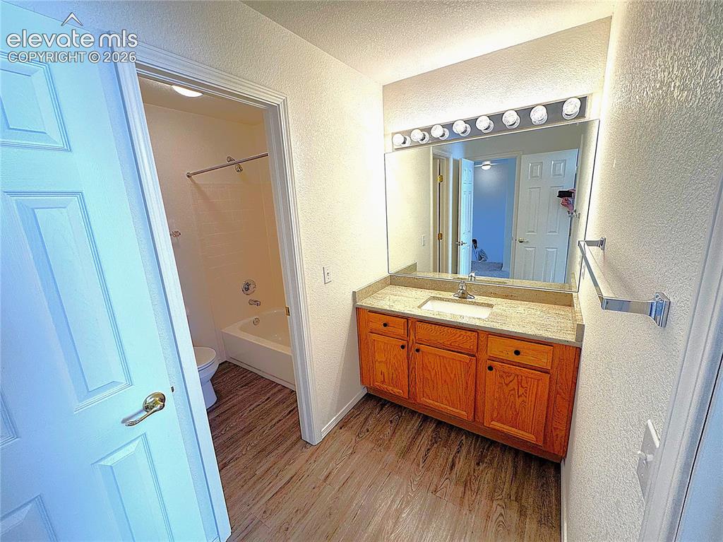 Image 28 of 49: Full upstairs Bathroom with new Granite Countertops and LVL Flooring
