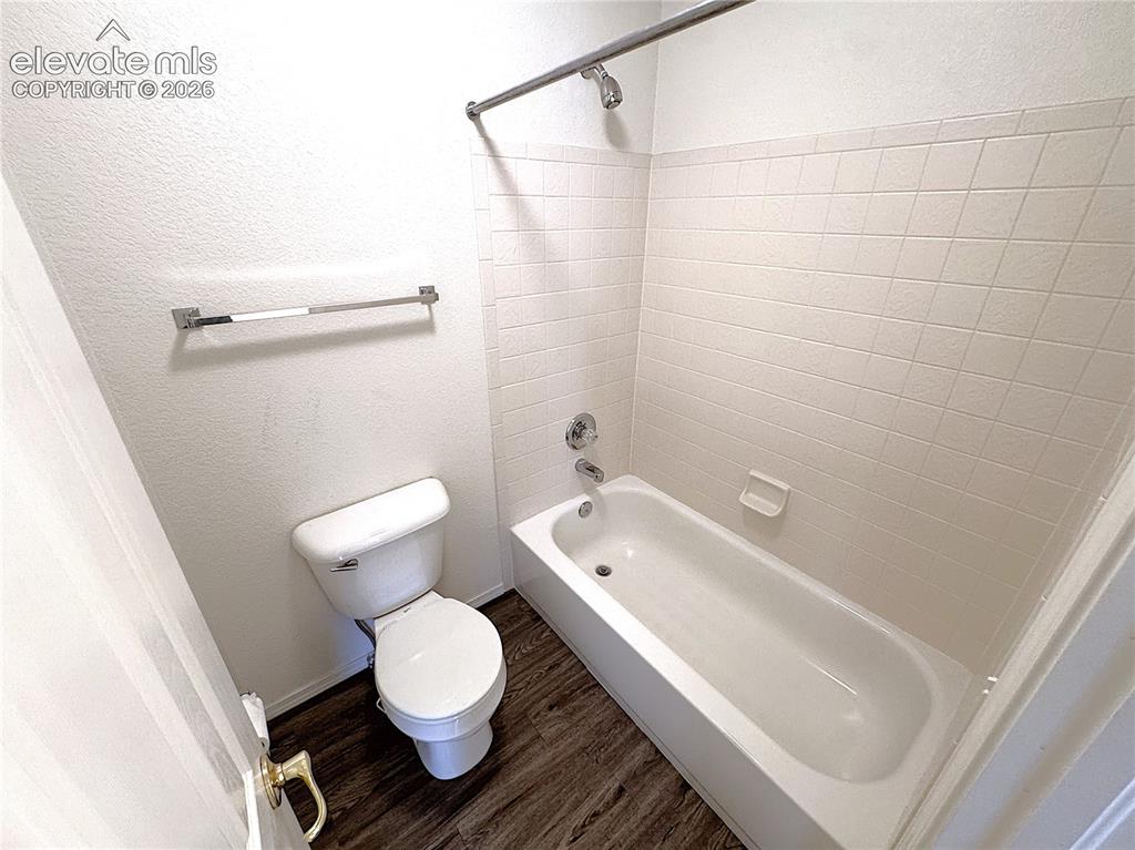 Image 29 of 49: Separate tub/shower and toilet