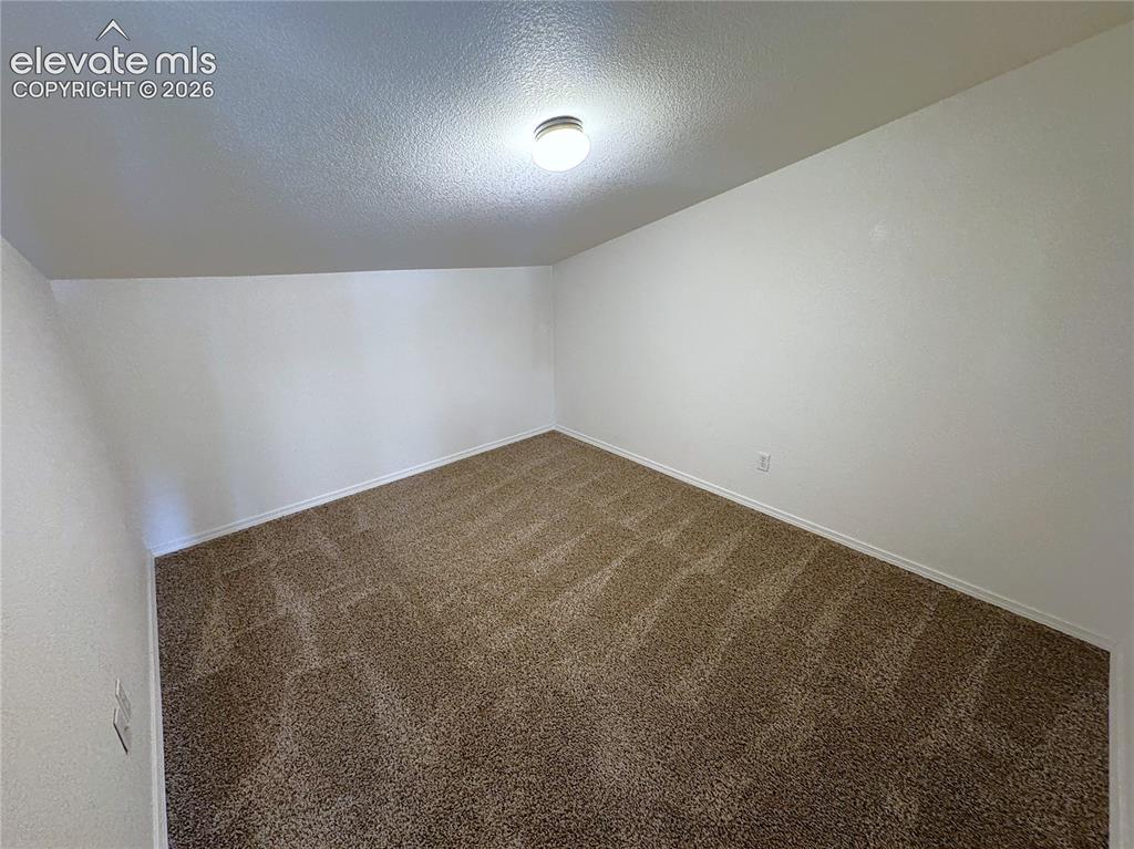 Image 33 of 49: Upstairs Bonus Room is perfect for a Den/Study or additional storage