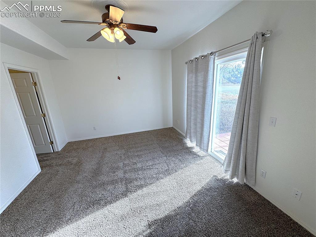 Image 9 of 49: Walkout Slider Door to Rear Patio