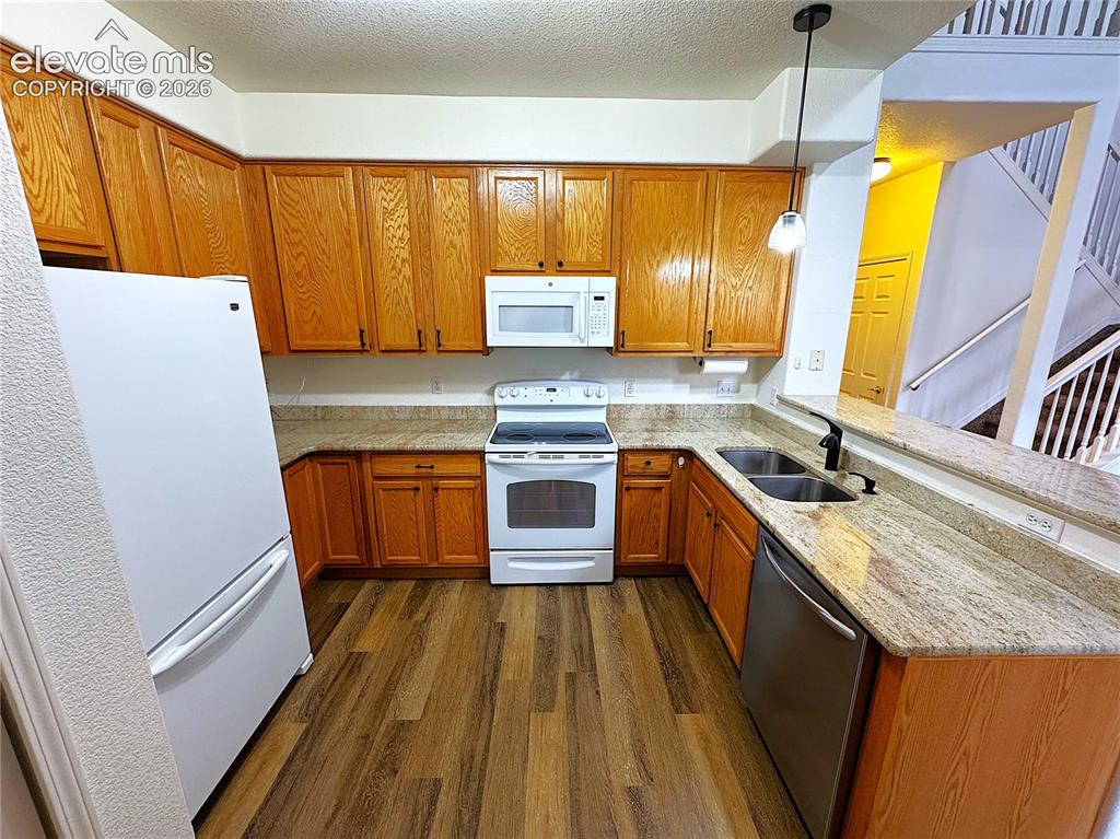 Image 9 of 49: Granite Countertops and NEW LVL Flooring