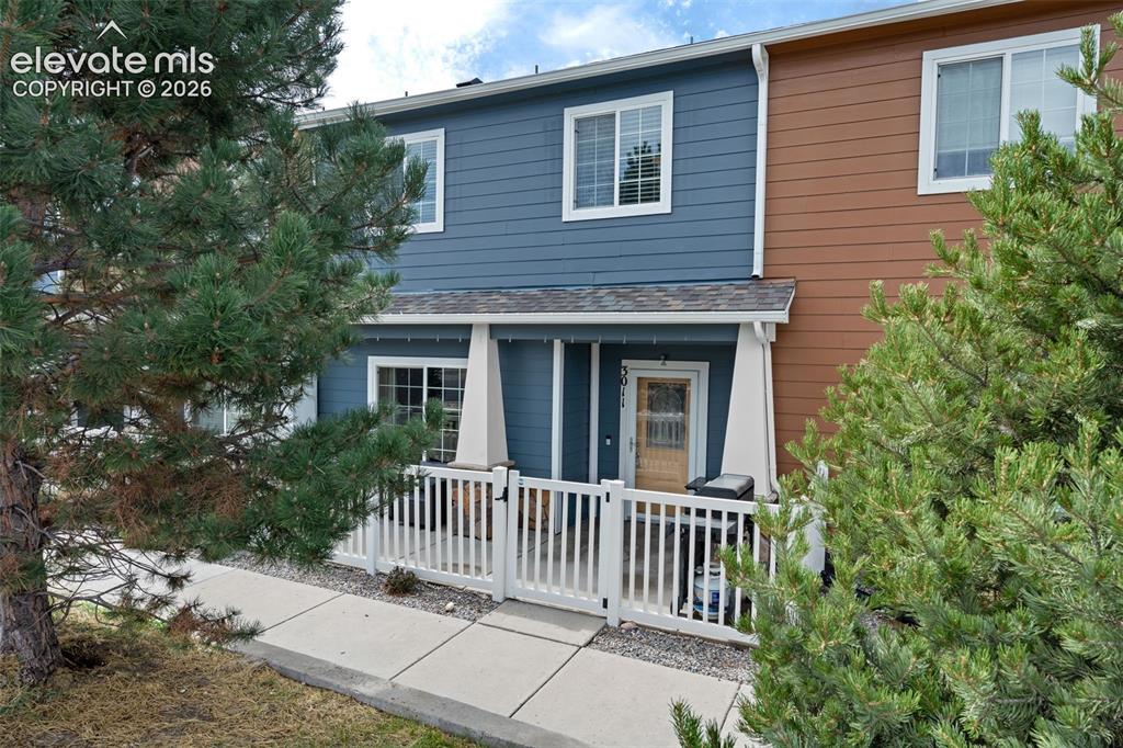 Image 1 of 32: Two-story exterior with blue siding and white trim