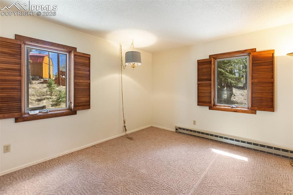 Image 18 of 43: Main level family room and dining area