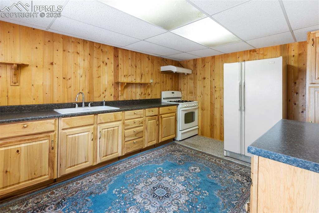 Image 23 of 43: Primary bathroom with jetted tub and dual sinks