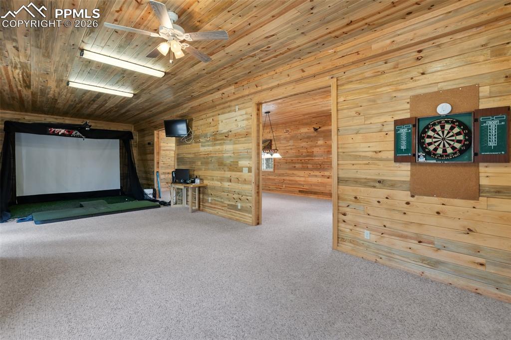 Image 27 of 43: Office with built in shelves and desk