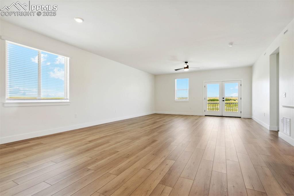 Image 3 of 15: Empty room featuring light wood finished floors, baseboards, and a ceiling 