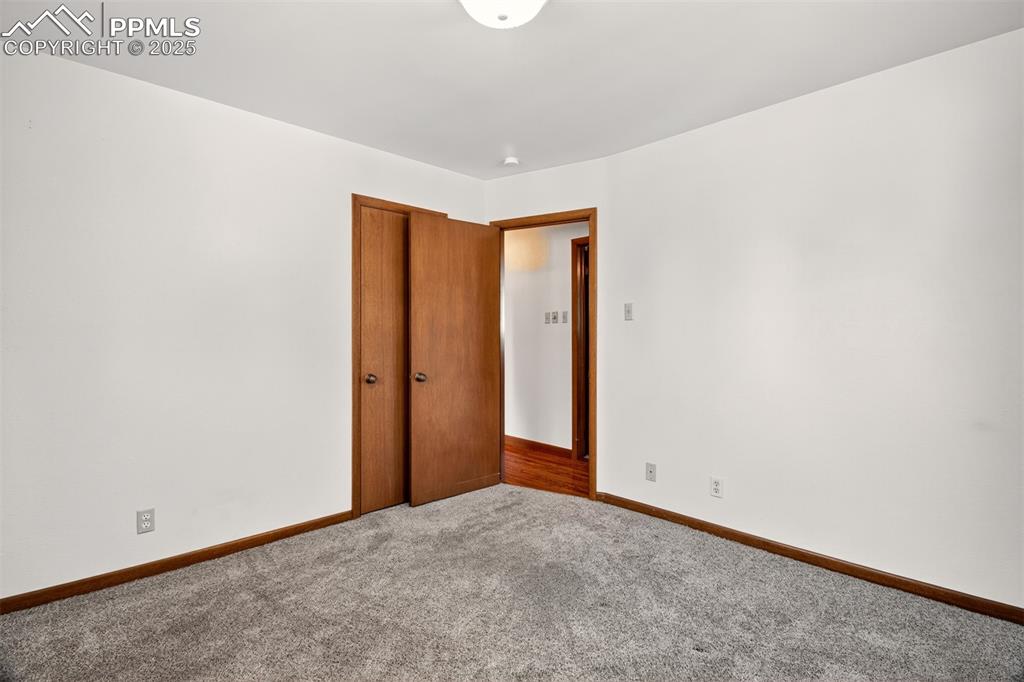 Image 18 of 43: Spare room with carpet flooring and baseboards