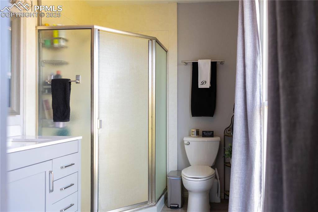 Image 30 of 49: Full bath featuring vanity and a stall shower