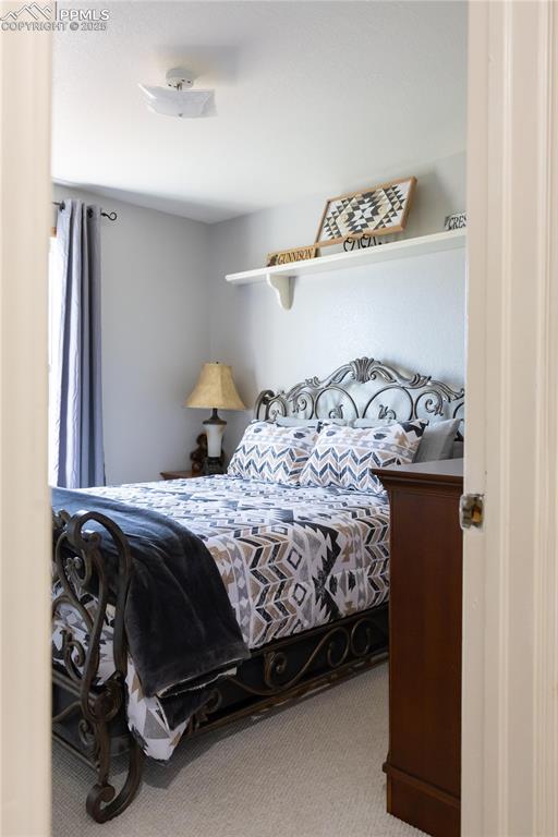 Image 43 of 49: Bedroom featuring carpet flooring