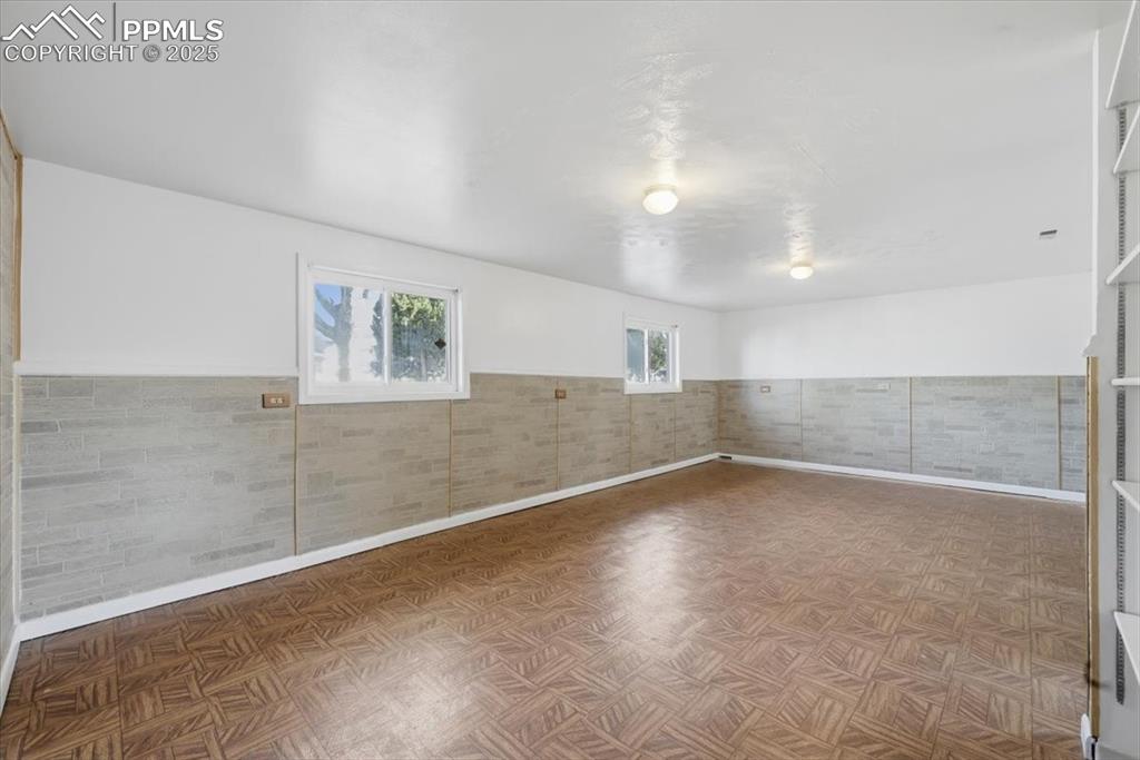 Image 19 of 26: Entertaining room in basement