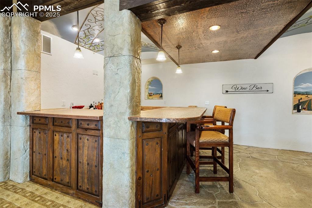 Image 42 of 50: Fully equipped bar with sink, dishwasher and mini fridge.