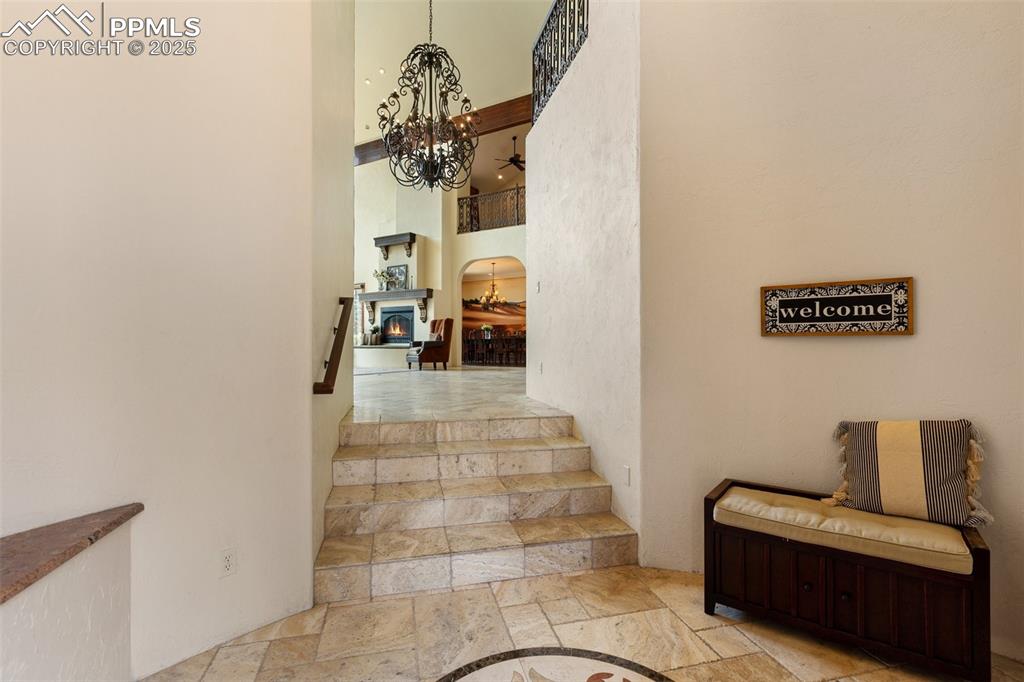 Image 6 of 50: Front entry way with two built in benches and double closets. Plenty of sto