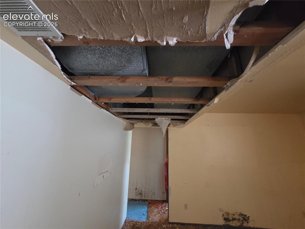 Image 11 of 17: damage in bsmt ceiling