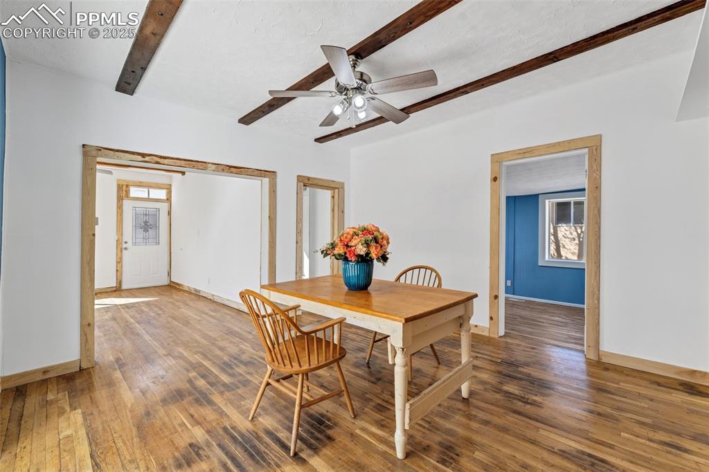 Image 10 of 34: Blue bedroom off dining room