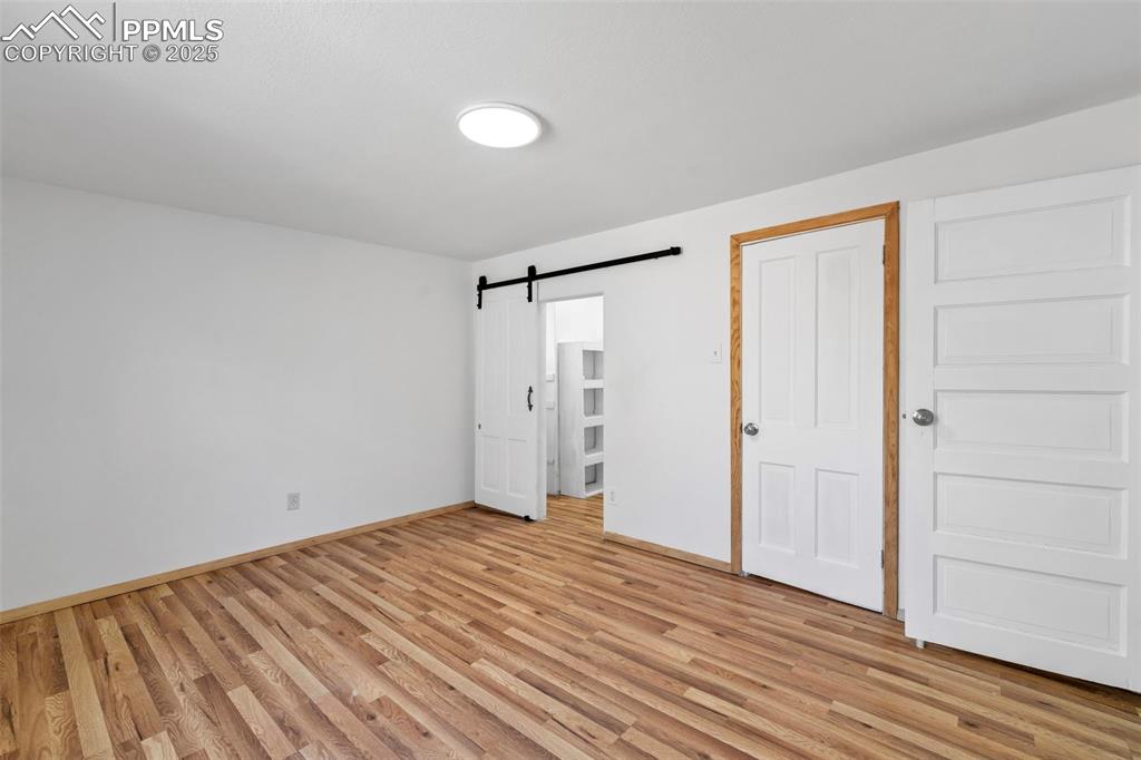 Image 19 of 34: Primary Bedroom with walk-in closet with window