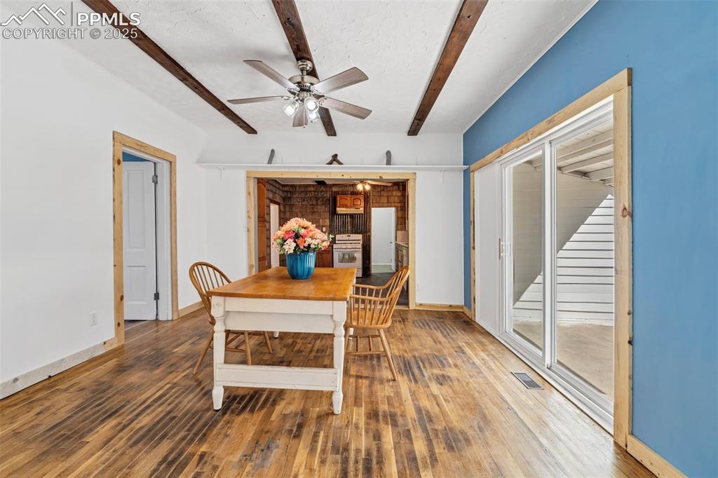 Image 5 of 34: Dining Room with Walkout to Partially Covered Cement Patio