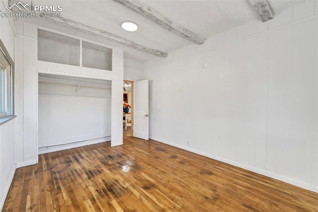 Image 9 of 34: White Bedroom off dining room