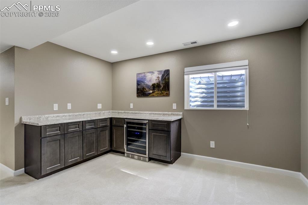 Image 27 of 42: 3rd Living Area with Wine Fridge