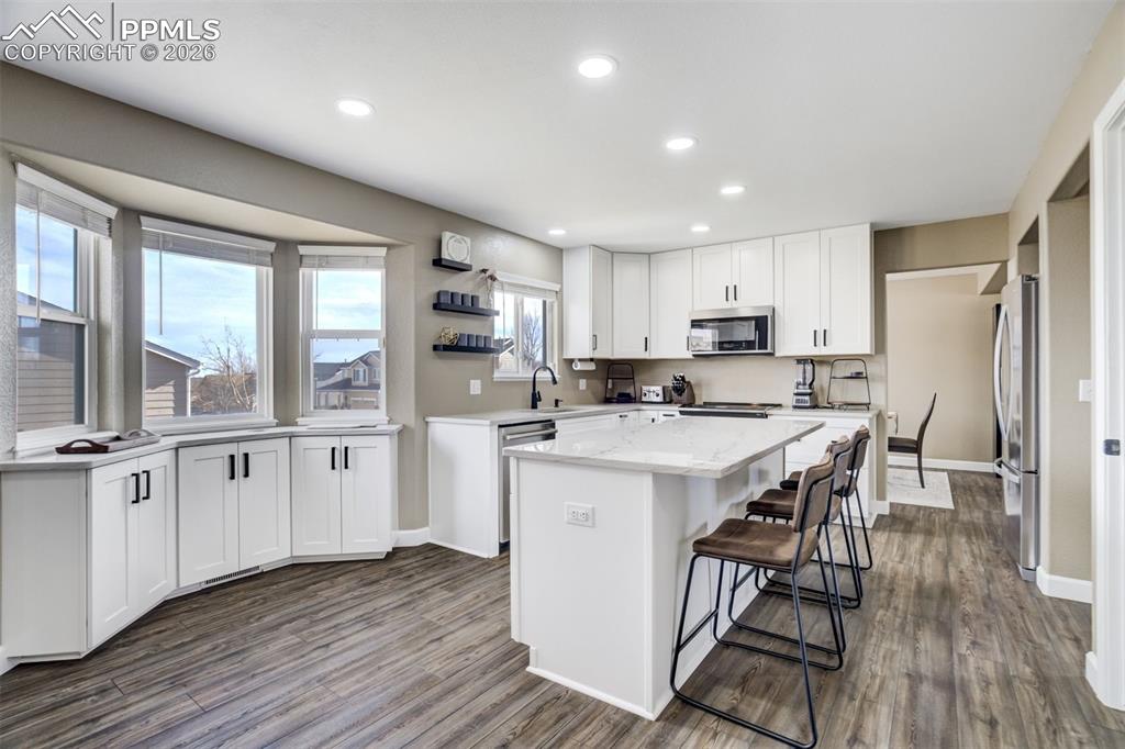 Image 7 of 42: Additional cabinets under window