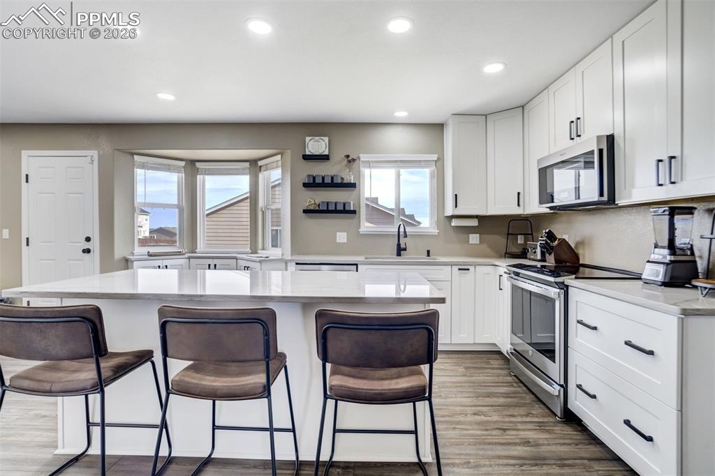 Image 8 of 42: New Cabinets, Large Island, Quartzite Countertops