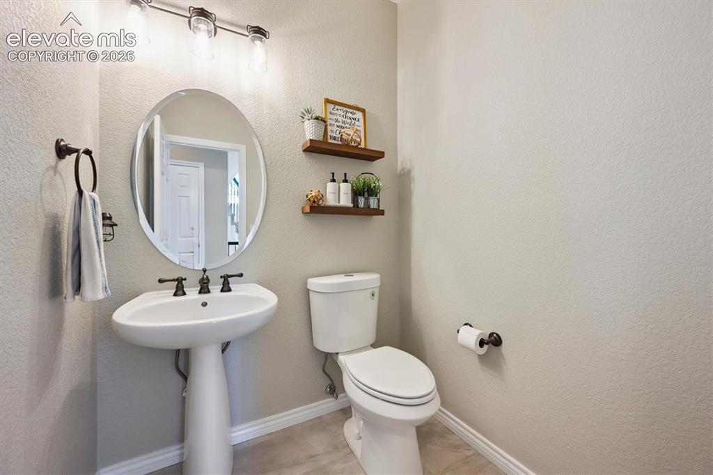 Image 10 of 46: Pedestal sink with oil-rubbed bronze faucet and coordinating towel ring