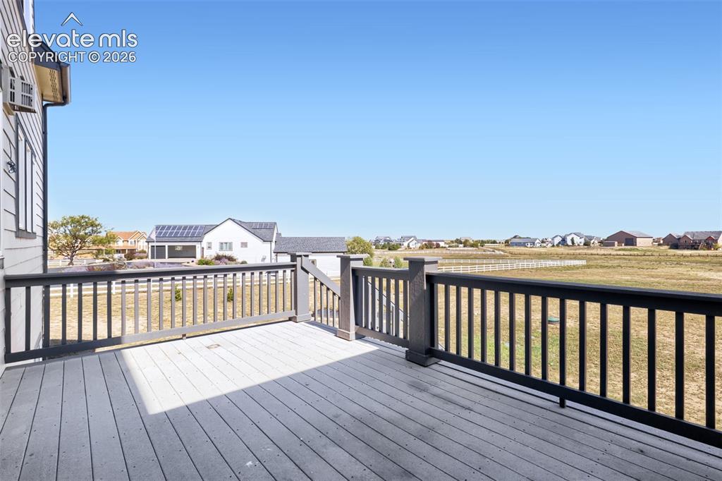 Image 15 of 37: Conveniently located right off the kitchen, this spacious composite deck fe