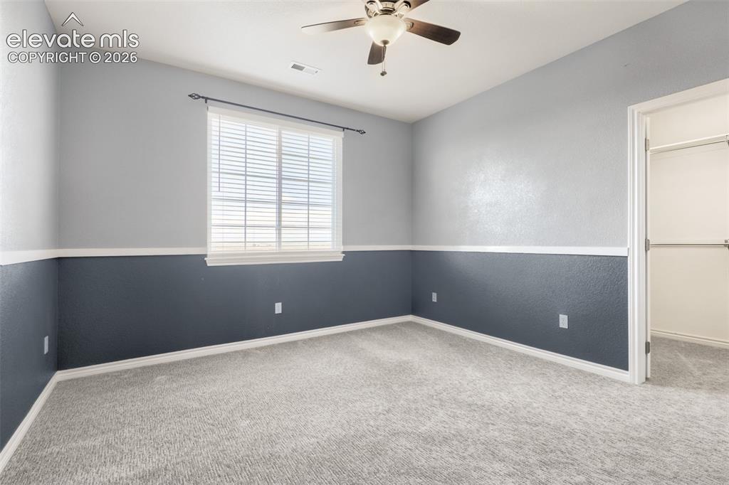 Image 26 of 37: Inviting second-floor bedroom showcasing tasteful two-tone accent paint acc