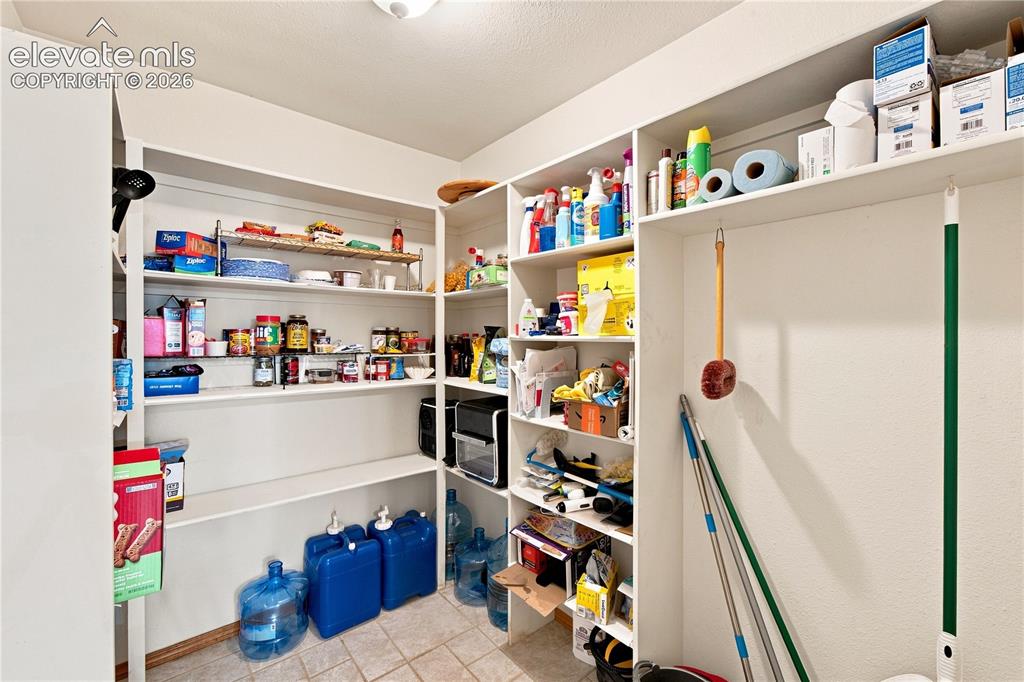 Image 24 of 37: Built-in shelving with multiple levels, integrated storage solutions, and a