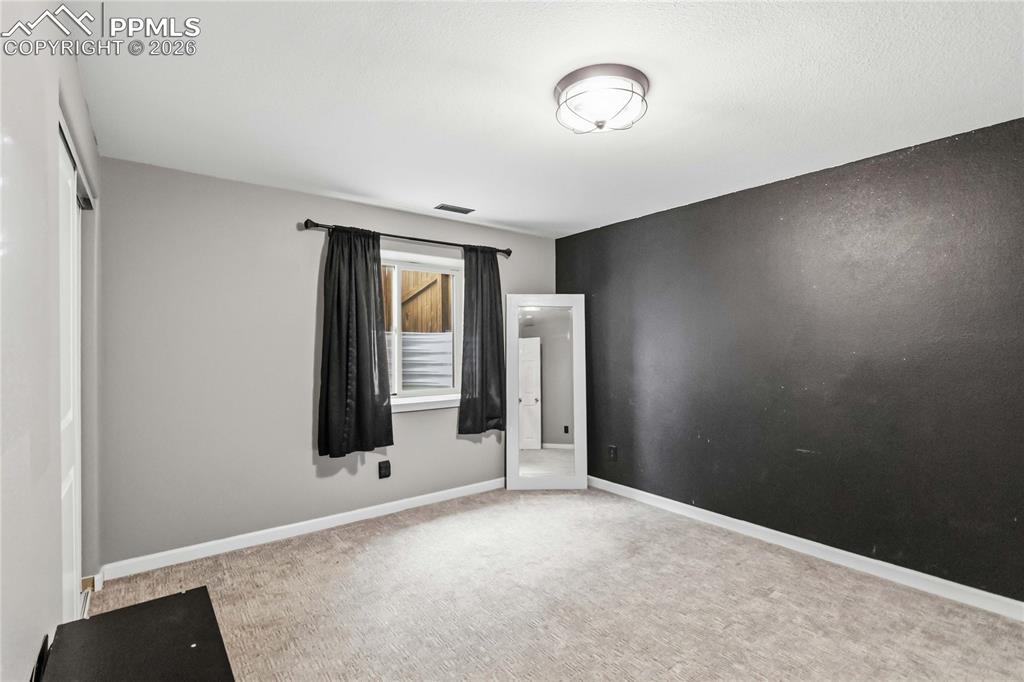 Image 36 of 43: Basement Bedroom