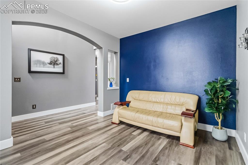 Image 6 of 43: Entryway room that could be an office or formal dining, or a sitting room. 