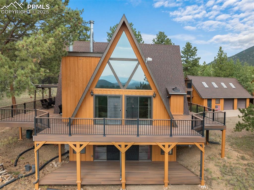Caption: stunning street view of this amazing home. Notice the decking!