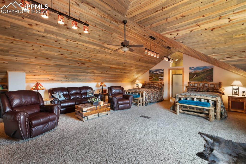 Image 36 of 50: huge living area, including 2 large beds, in cabin 2