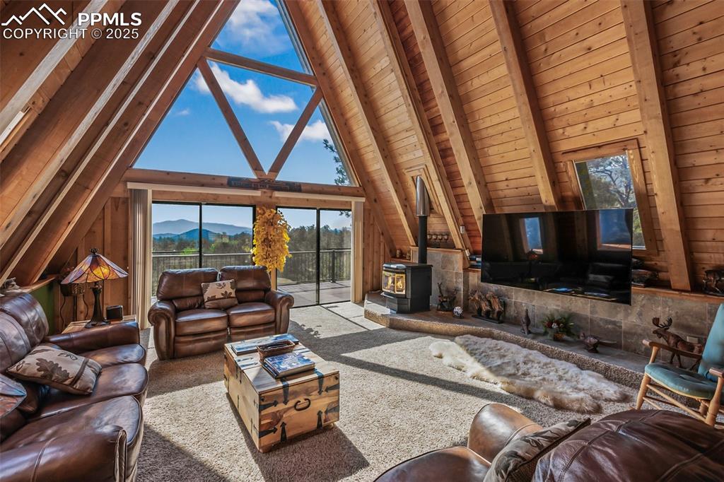 Image 4 of 50: Magnificent great room on the main level.  Massive vaulted ceilings