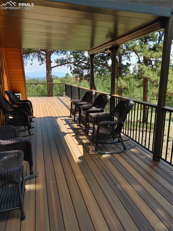 Image 48 of 50: Beautiful covered deck off of the kitchen