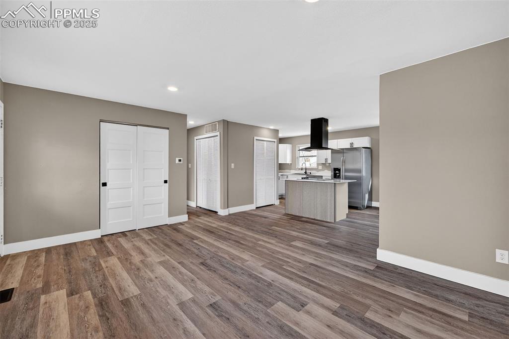 Image 7 of 29: Living room and kitchen