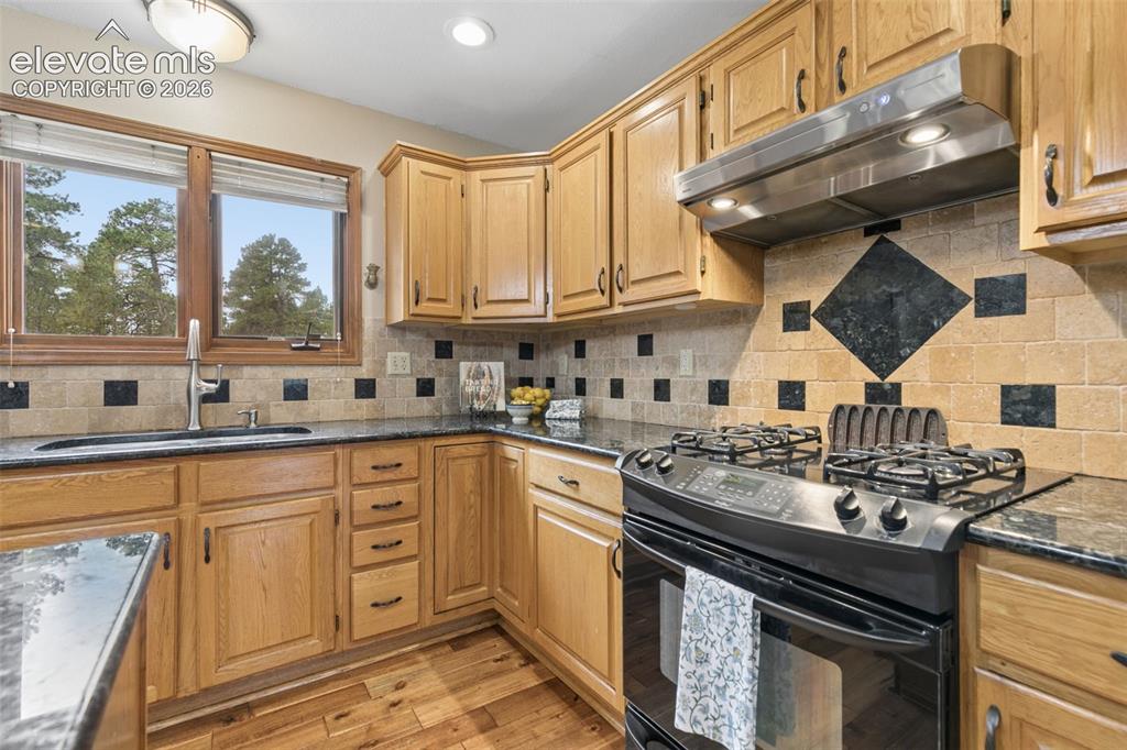 Image 14 of 50: Kitchen with a Forest View
