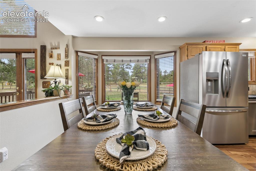 Image 17 of 50: Plenty of Room & Natural Light -Extra Dining Area Attached to Kitchen & Ope