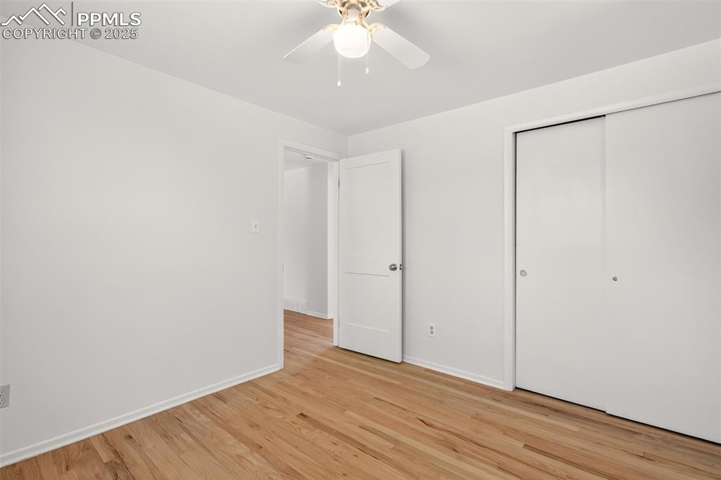 Image 10 of 17: Unfurnished bedroom with light wood-style flooring, a closet, and a ceiling
