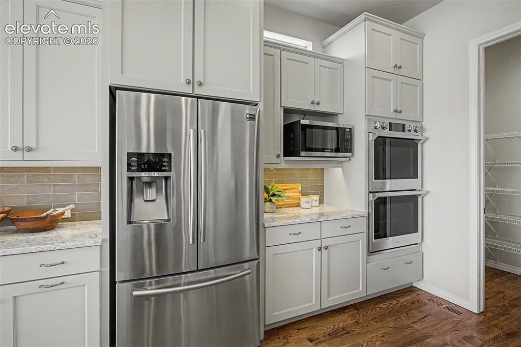 Image 16 of 50: Large walk in pantry completes the kitchen