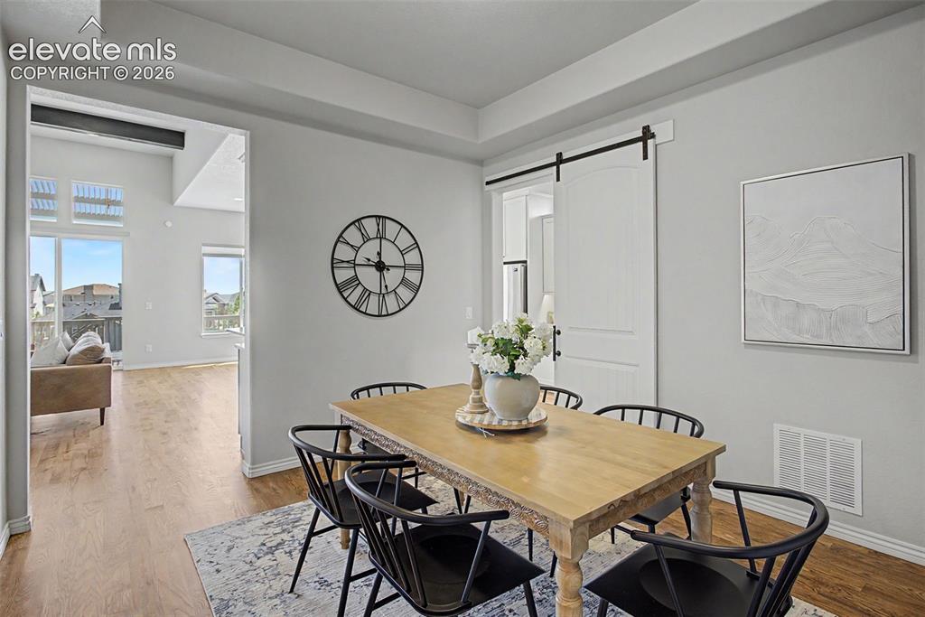 Image 17 of 50: Formal dining room connected to the kitchen and living room