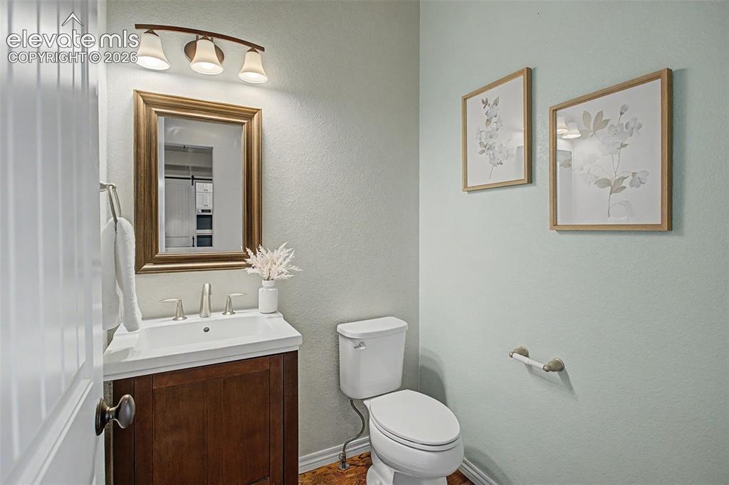 Image 18 of 50: Main level half bathroom