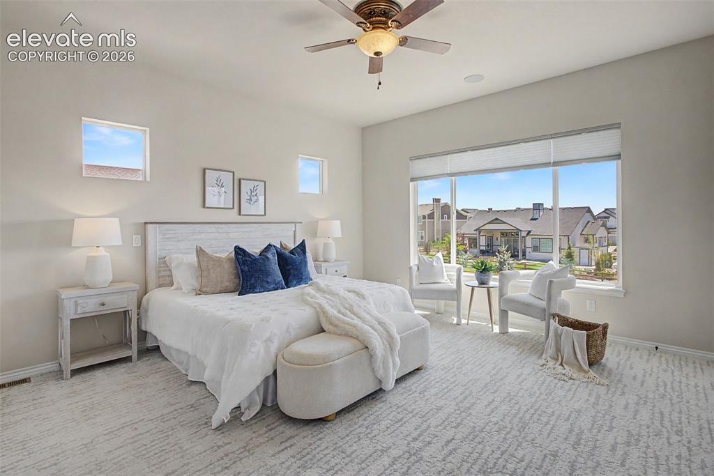 Image 19 of 50: Primary suite with views from every window