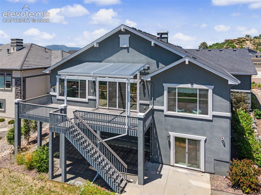 Image 3 of 50: Huge oversized deck with custom covering allowing for sunshine or shade