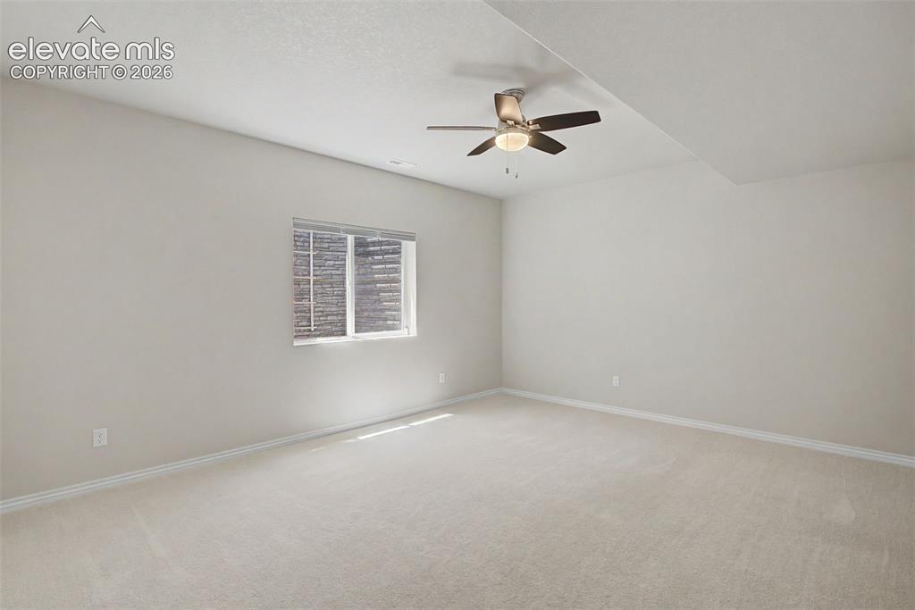 Image 35 of 50: Downstairs bedroom